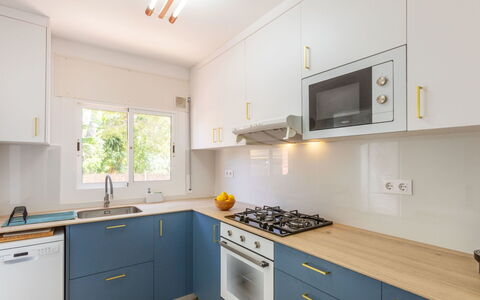 Mirror: Kitchen, Countertop, Kitchen Appliance, Major Appliance, Wood, Cabinetry, Interior Design, Flooring, Kitchen Stove, Floor