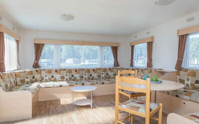 Lommel 100: Table, Window, Furniture, Building, Chair, Floor, Wood, Couch, Flooring, Curtain
