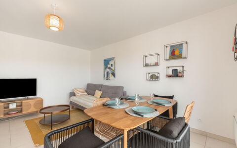 Eden Riviera: Furniture, Property, Table, Picture Frame, Wood, Interior Design, Couch, Chair, Orange, Living Room