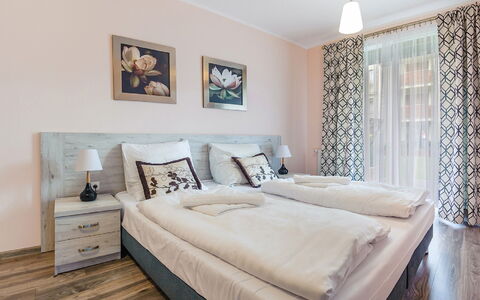 Ustka Wczasowa: Furniture, Property, Window, Comfort, Wood, Pillow, Cabinetry, Bed Frame, Drawer, Interior Design