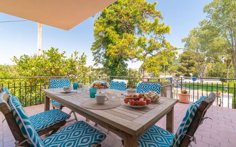 Can Jeroni: Table, Plant, Furniture, Sky, Property, Flowerpot, Chair, Outdoor Table, Tableware, Nature