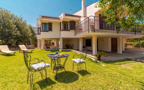 Can Jeroni: Plant, Building, Property, Sky, Window, Tree, Nature, Table, Shade, Land Lot