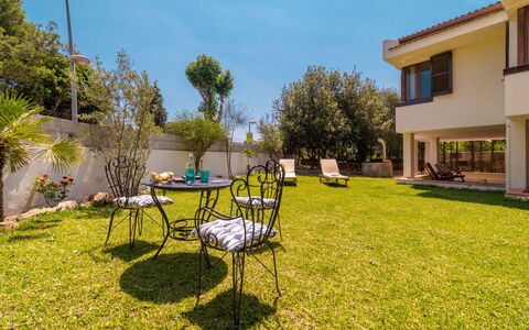 Can Jeroni: Plant, Sky, Table, Window, Building, Natural Landscape, Chair, Tree, Shade, Outdoor Table