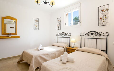 Villa Delfín: Table, Furniture, Property, Picture Frame, Lighting, Interior Design, Textile, Tablecloth, Wood, Yellow