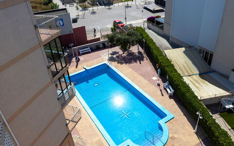 Blue Sea: Water, Building, Property, Swimming Pool, Window, Azure, Chair, Plant, Shade, Outdoor Furniture