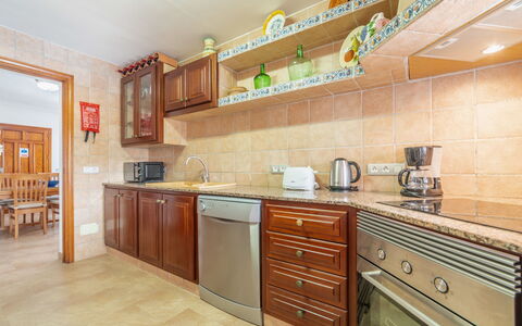 Pintor Beach House: Countertop, Cabinetry, Furniture, Tap, Kitchen Stove, Kitchen Appliance, Kitchen, Drawer, Wood, Building