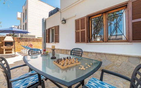 Pintor Beach House: Table, Furniture, Property, Daytime, Building, Window, Chair, Sky, Azure, Wood
