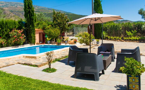 Rincón del sur: Plant, Sky, Furniture, Property, Water, Tree, Azure, Botany, Shade, Outdoor Furniture