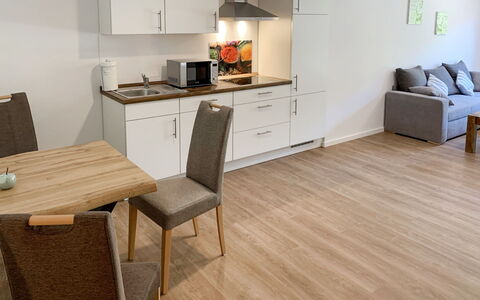 Spiekeroog: Cabinetry, Property, Furniture, Countertop, Couch, Kitchen, Table, Kitchen Appliance, Building, Wood
