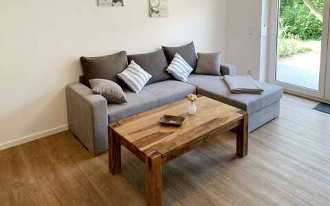 Spiekeroog: Table, Couch, Furniture, Property, Product, Comfort, Wood, Interior Design, Window, Lighting