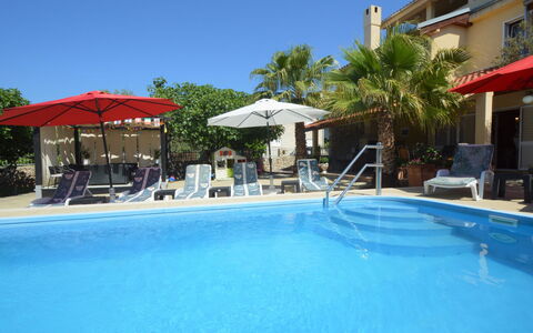 Vodice Tribunj 143: Water, Sky, Property, Plant, Building, Cloud, Swimming Pool, Tree, Residential Area, Grass