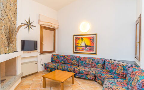 Rei Sole (Rei305): Couch, Furniture, Property, Picture Frame, Table, Comfort, Wood, Interior Design, Orange, Lighting