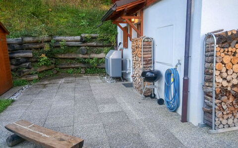 Ambigu: Building, Plant, Wood, Outdoor Bench, Asphalt, Road Surface, House, Outdoor Furniture, Wall, Flooring