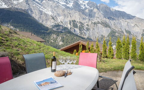 Ambigu: Table, Sky, Cloud, Mountain, Property, Plant, Furniture, Chair, Natural Landscape, Outdoor Furniture