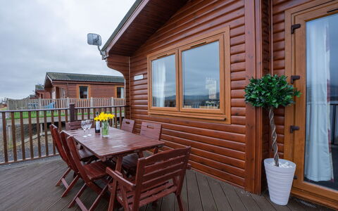 Loch Leven Lodge 12: Building, Sky, Window, Property, Plant, Furniture, Table, Flowerpot, Wood, House