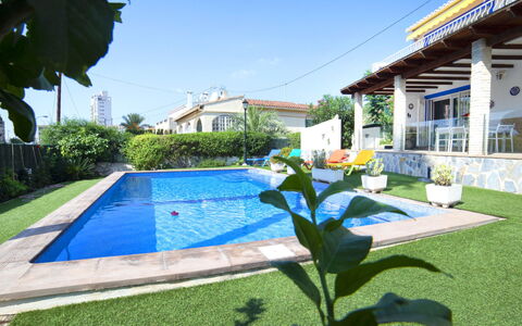 Teruel: Plant, Building, Sky, Property, Water, Azure, Shade, Flower, Swimming Pool, Grass