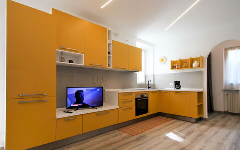 Tucano: Cabinetry, Furniture, Countertop, Building, Orange, Hall, Interior Design, Flooring, Floor, Kitchen