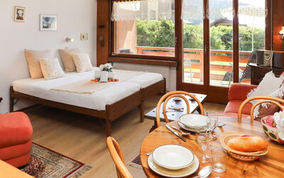 Verbier 231: Table, Furniture, Property, Building, Tableware, Comfort, Dishware, Wood, Window, Orange