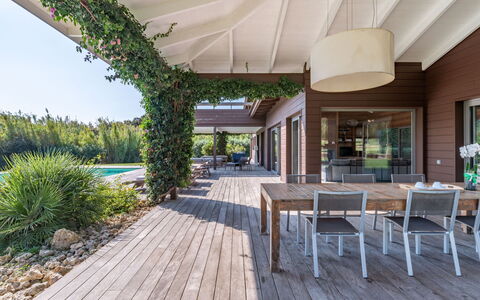 Villa Lavezzi: Plant, Furniture, Property, Table, Chair, Shade, Architecture, Wood, Interior Design, Outdoor Furniture