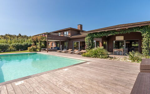Villa Lavezzi: Sky, Water, Plant, Property, Building, Window, Swimming Pool, Wood, Shade, House