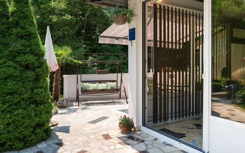 Karin: Plant, Building, Green, Tree, Wood, Shade, Grass, Door, House, Residential Area