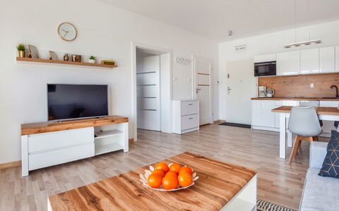 Grzybowo Seaside: Table, Property, Furniture, Cabinetry, Orange, Wood, Couch, Interior Design, Lighting, Flooring