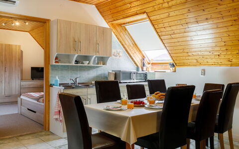 Küsz: Furniture, Table, Cabinetry, Building, Chair, Wood, Countertop, Interior Design, Flooring, Kitchen