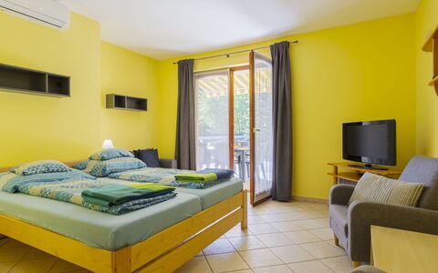 Jókai: Furniture, Interior Design, Room, Wood Stain, Chair, Hardwood, Hotel, Bed, Pillow, Curtain