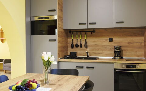 Jókai: Furniture, Kitchen, Countertop, Kitchen Appliance, Interior Design, Wood, Cabinetry, Flooring, Major Appliance, Home Appliance