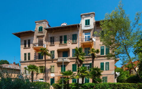 Emillia: Sky, Building, Plant, Property, Window, Vehicle, Tree, Urban Design, Car, Condominium