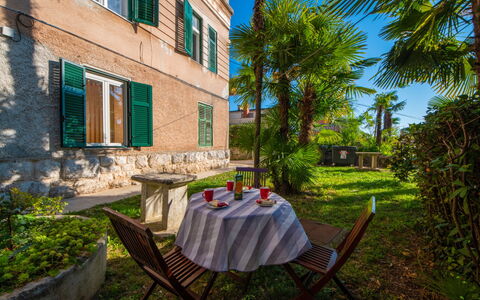 Emillia: Plant, Daytime, Building, Property, Window, Chair, Sky, Table, Tablecloth, Outdoor Furniture