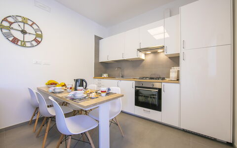 Pontremoli Apartments: Furniture, Cabinetry, Countertop, Kitchen Appliance, Table, Kitchen, Interior Design, Building, House, Wood