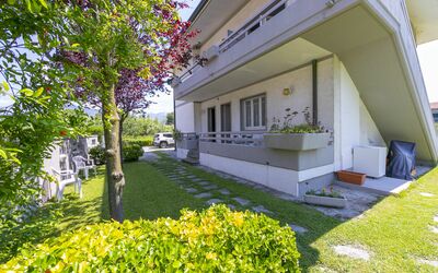 Pontremoli Apartments: Plant, Building, Property, Leaf, Botany, Grass, Tree, Shade, Urban Design, Neighbourhood