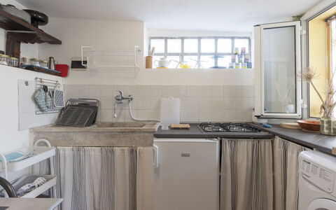 Casetta Porta Verde: Kitchen Sink, Sink, Cabinetry, Property, Countertop, Tap, Window, Kitchen Stove, Kitchen, Kitchen Appliance