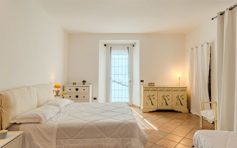 Lungolago: Interior Design, Furniture, Flooring, Wall, Floor, Bedroom, Bed, Ceiling, Room, Lighting
