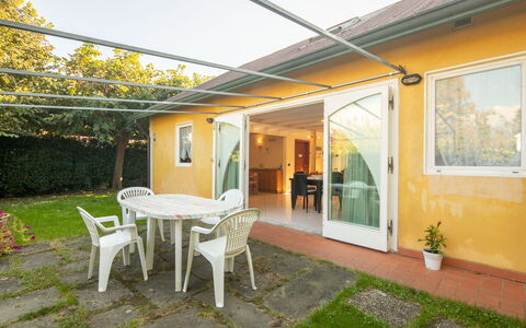 Villa Isola: Plant, Building, Furniture, Property, Window, Table, Chair, Interior Design, Shade, Architecture