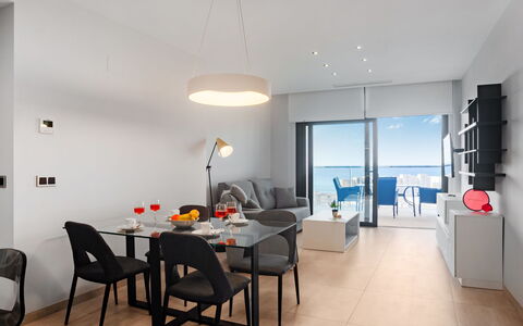 Sunset Waves: Table, Furniture, Building, Chair, House, Floor, Flooring, Lamp, Living Room, Hall