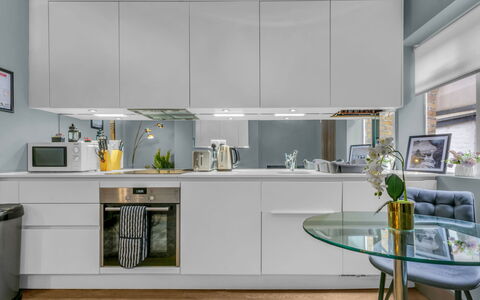 Cleveland Apartments: Kitchen Appliance, Kitchen, Countertop, Furniture, Cabinetry, Interior Design, Major Appliance, Flooring, Light Fixture, Wood