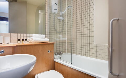 Lawrence House: Plumbing Fixture, Bathtub, Shower Head, Mirror, Property, Tap, Sink, Bathroom, Shower, Bathroom Sink