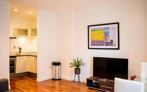 Discovery Dock: Property, Furniture, Comfort, Couch, Plant, Wood, Interior Design, Television, Flooring, Building