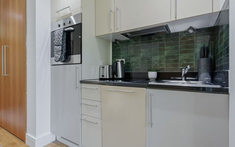 Indescon Studio: Kitchen Appliance, Major Appliance, Flooring, Interior Design, Kitchen, Countertop, Wood, Floor, Furniture, Cabinetry
