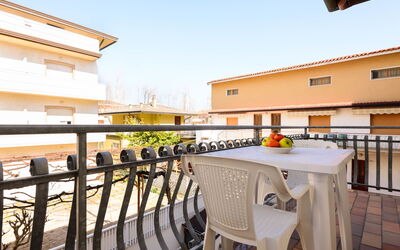 Lignano Sabbiadoro 655: Table, Property, Building, Sky, Window, Wood, Interior Design, Cloud, Lighting, Outdoor Furniture