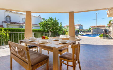 Villa Cantos: Furniture, Chair, Table, Kitchen & Dining Room Table, Outdoor Furniture, Outdoor Table, Shade, Wood Stain, Patio, Dining Room