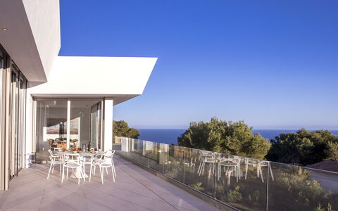 Villa Halcon al Mar: Sky, Plant, Building, Chair, Shade, Seaside Resort, Wood, House, Porch, Condominium