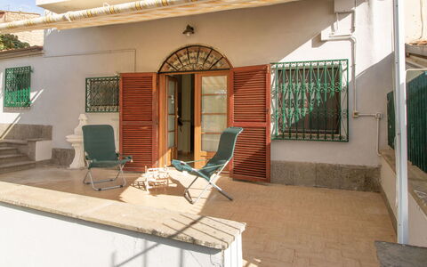 Kiwi e L'Uva - Tuscia: Furniture, Shade, Window, Interior Design, Outdoor Furniture, Building, Chair, Leisure, Wall, Residential Area