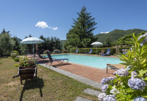 Villa Rosata: Water, Plant, Sky, Furniture, Swimming Pool, Cloud, Umbrella, Nature, Chair, Tree