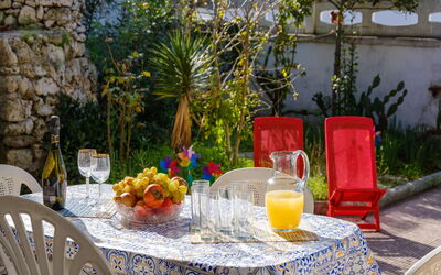 Alla Rosa Dei Venti: Table, Plant, Furniture, Tableware, Property, Chair, Outdoor Table, Orange, Textile, Tablecloth