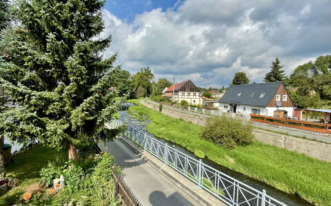 Sissi: Cloud, Plant, Sky, Building, Natural Landscape, Land Lot, Tree, Road Surface, Fence, Grass