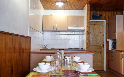 Tignes 245: Cabinetry, Property, Tableware, Furniture, Countertop, Table, Wood, Lighting, Kitchen, Interior Design