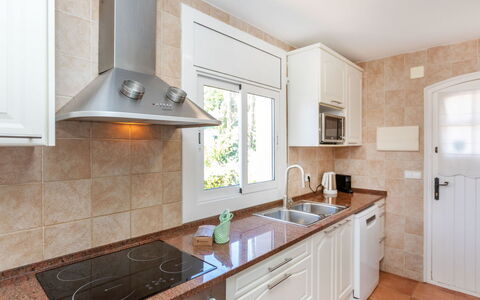 El Suro: Kitchen, Countertop, Cabinetry, Kitchen Appliance, Major Appliance, Flooring, Furniture, Wood, Interior Design, Home